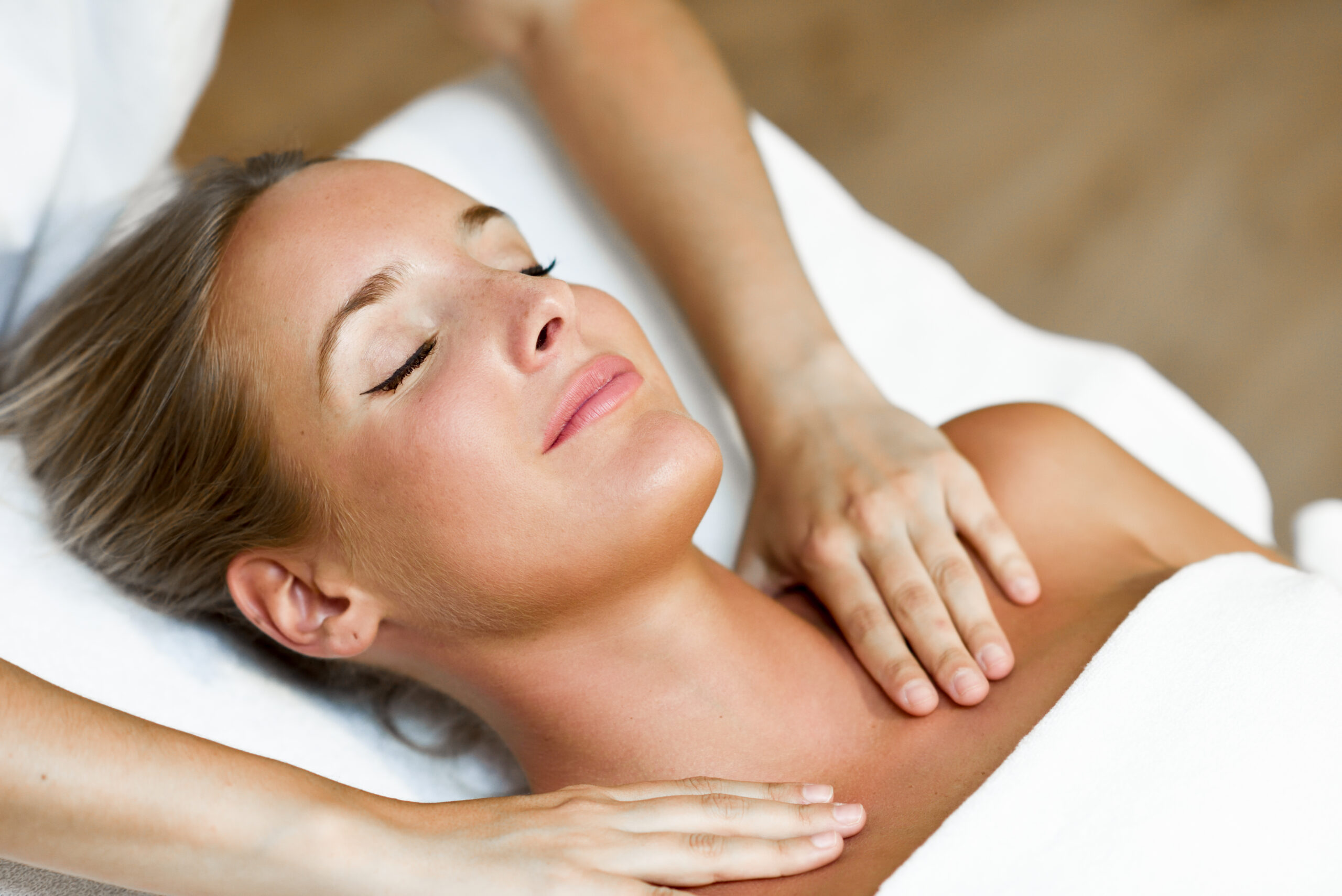 Young woman receiving a head massage in a spa center. Favorite Pilates Repertoire On The BASI Systems Cadillac To Enhance Spinal Articulation